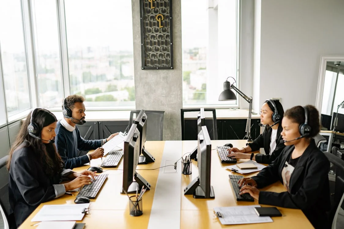Talent Surge office-based specialists working at monitored desks